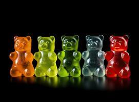 Jelly bears on a black background. Multicolored sweets on a black background. Created with Generative AI technology. photo