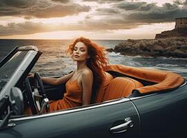 Woman enjoying beautiful view on the ocean, sitting on the convertible car on the rocky coast during a sunset. Created with Generative AI technology. photo