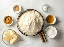 Baking culinary ingredients. Eggs, flour, whisk and kitchen textile on bright grey concrete background. Cookies, pie or cake recipe mockup. Top view. Created with Generative AI technology. photo