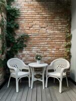 Garden white chairs and a table with flowers against the backdrop of greenery and the building. Created with Generative AI technology. photo