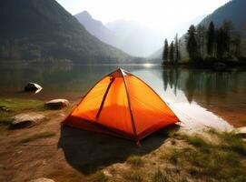 tourist lit tent by the lake at sunset. Dramatic sky. Orange lit inside the tent and a fire over the misty river at sunset. Dramatic sunset. Summer landscape. Created with Generative AI technology. photo