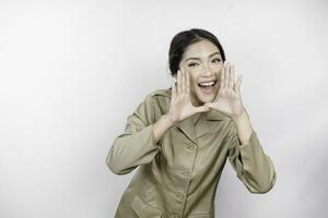 Young beautiful civil worker woman is shouting or yelling isolated by a white background. Communication concept photo
