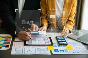 UX graphic designer planning application process development prototype wireframe for web smart phone. Creative digital development agency. photo