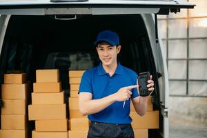 Portrait of courier delivery Asian man searching the address on digital tablet. Delivery service, delivery home and shipping concept. photo