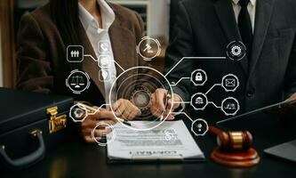 justice and law concept. asian woman lawyer working and judge in a courtroom the gavel, working with tablet and laptop with VR icon photo
