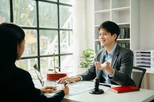 Business and Male lawyer or judge consult having team meeting with client, Law and Legal services concept.Customer service good cooperation in office photo