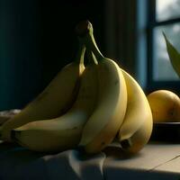 Bunch of bananas on a wooden table near the window. Selective focus. photo