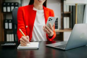 Working Process in Modern Office. Young Woman Account Manager Working at Table with New Business Project. Typing keyboard,Using Contemporary Laptop. photo