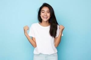 Woman posing with arms crossed on blue background photo