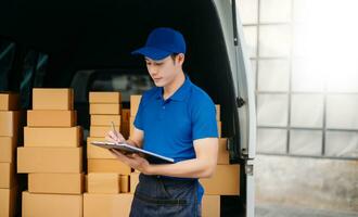 Portrait of courier delivery Asian man searching the address on digital tablet. Delivery service, delivery home and shipping concept. photo
