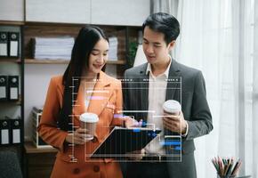 Business team hand Project manager working and update tasks and Gantt chart scheduling virtual diagram.with smart phone, tablet and laptop in office. photo