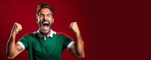Italian football fan celebrating a victory on green white and red background with empty space for text photo