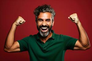 Portuguese football fan celebrating a victory on red and green background with empty space for text photo