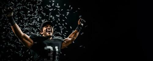 American football player celebrating a championship win on black background with empty space for text photo