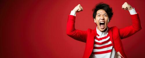 Japanese football fan celebrating a victory on red and white background with empty space for text photo