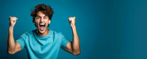 American football fan celebrating a victory on blue background with empty space for text photo