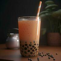 A glass of Thai milk tea with bubble on wooden table  black background photo