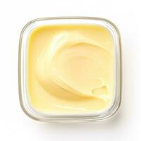 Butter softened top view isolated on white background photo