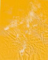 Yellow crumpled paper texture background photo