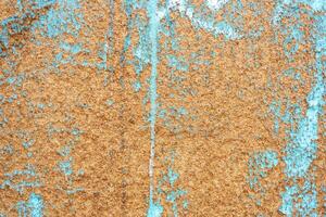 Grunge abstract background. Chipboard with blue chipped top coat. photo