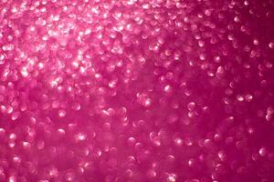 Bright pink defocused abstract shiny glitter background photo