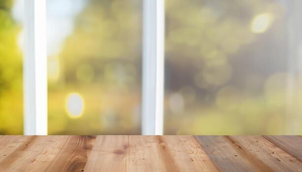 , Wooden table top on blur background of window and bokeh image. photo