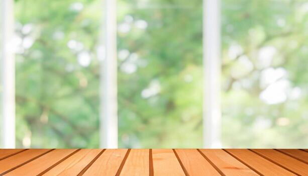 , Wooden table top on blur background of window and bokeh image. photo