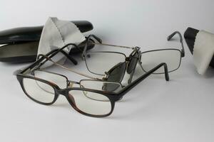 A bunch of old prescription eyeglasses photo