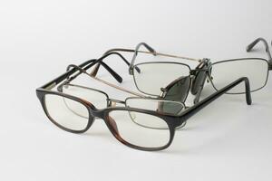 A bunch of old prescription eyeglasses photo