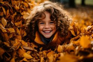 A girl playing in a pile of leaves photo