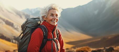 Woman in the mountains with backpack photo