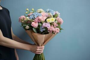 Woman holding flower bouquet photo