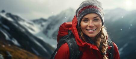 Woman in the mountains with backpack photo