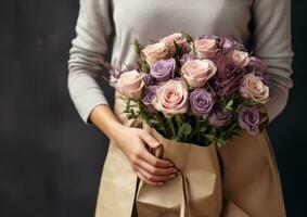 Woman holding flower bouquet photo