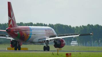 AMSTERDAM, THE NETHERLANDS JULY 27, 2017 - Air Malta Airbus A320 9H AEP braking after landing on runway 18R Polderbaan. Shiphol Airport, Amsterdam, Holland video