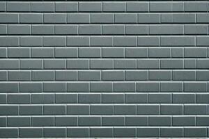 Grey brick wall texture background. Tiled. photo