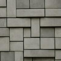 Gray stones of varying sizes concrete blocks built into a wall, can be used as background photo