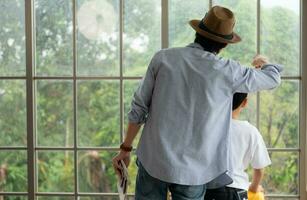 Father and son are happy and ready to travel on a weekend trip photo