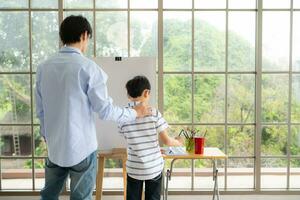 Family of artists that spend weekends at home painting with water photo