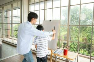 Family of artists that spend weekends at home painting with water photo