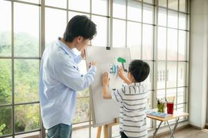 Family of artists that spend weekends at home painting with water photo