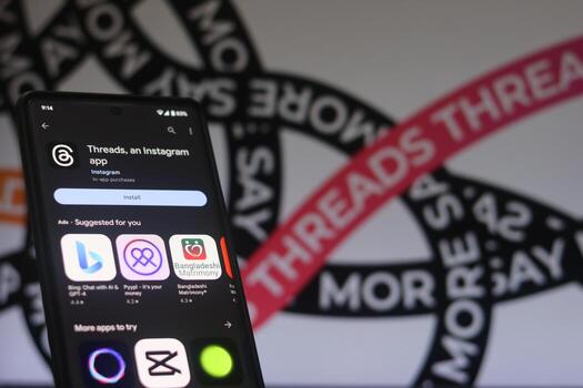 installing Threads app on a phone, The threads logo is displayed on a smartphone screen. Threads new social network, Say More Campaign by Threads, Threads Instagram, July 20, 2023 - Dhaka, Bangladesh photo