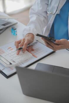 Professional lab. Amazing longhaired medical worker wearing uniform while using microscope during research photo