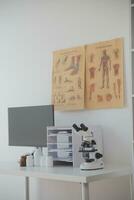 Professional lab. Amazing longhaired medical worker wearing uniform while using microscope during research photo