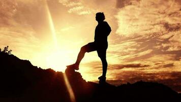 Slow motion. Men practice trail running in the evening. Silhouette of man running video