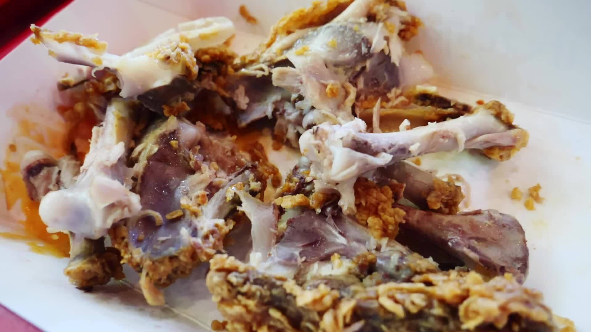 leftover chicken bones Food waste concept and fresh waste in fast food restaurant 27010636 Stock