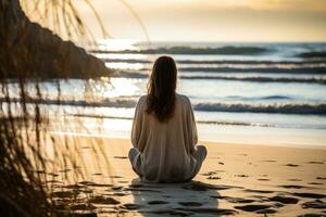 By the shore a person listens to the rhythmic waves finding solace in the ebb and flow a moment of inner peace on World Mental Health Day photo