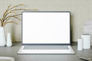 3D rendering of white laptop computer placed photo