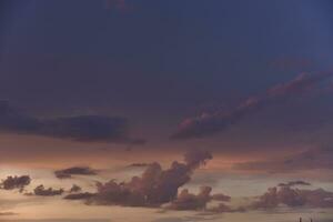 Pink clouds and evening sunset sky after a thunderstorm. Blue-red sunset evening. Beautiful pink clouds. photo