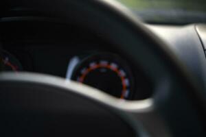 Steering wheel and speedometer in the car. The dashboard of the car. photo